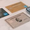 a group of credit cards sitting next to a cell phone
