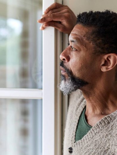 middle aged black man gazing out windowGettyImages 1171712738 16x9 1