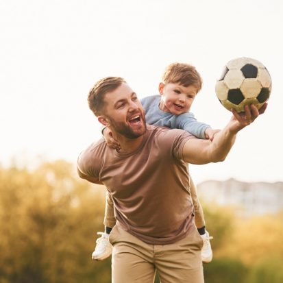real football soccer ball happy father with son are 65571917 Large